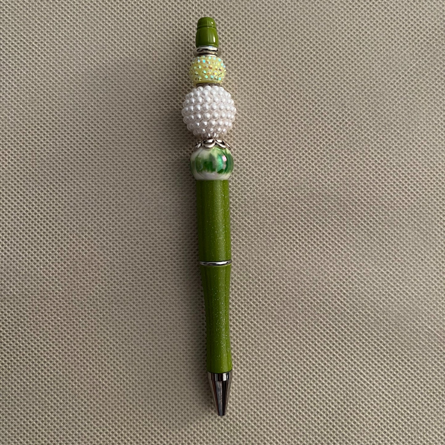 green beaded ink pen