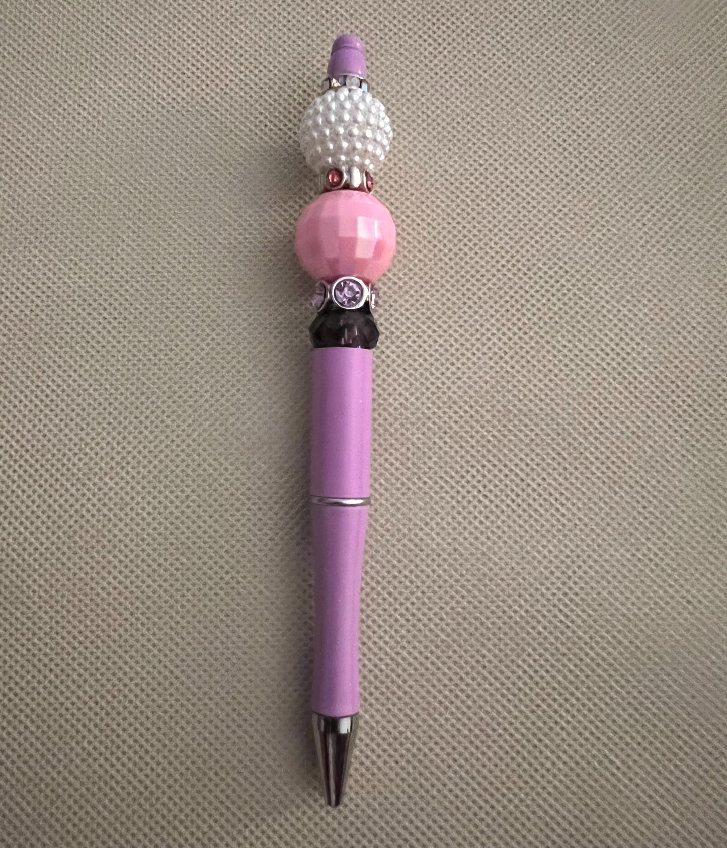 purple beaded ink pen